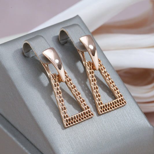 Elegant geometric earrings with sparkling zirconia in noble gold