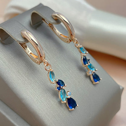 Enchanting earrings with blue and golden crystals