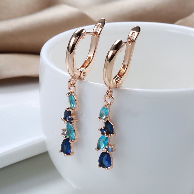 Enchanting earrings with blue and golden crystals