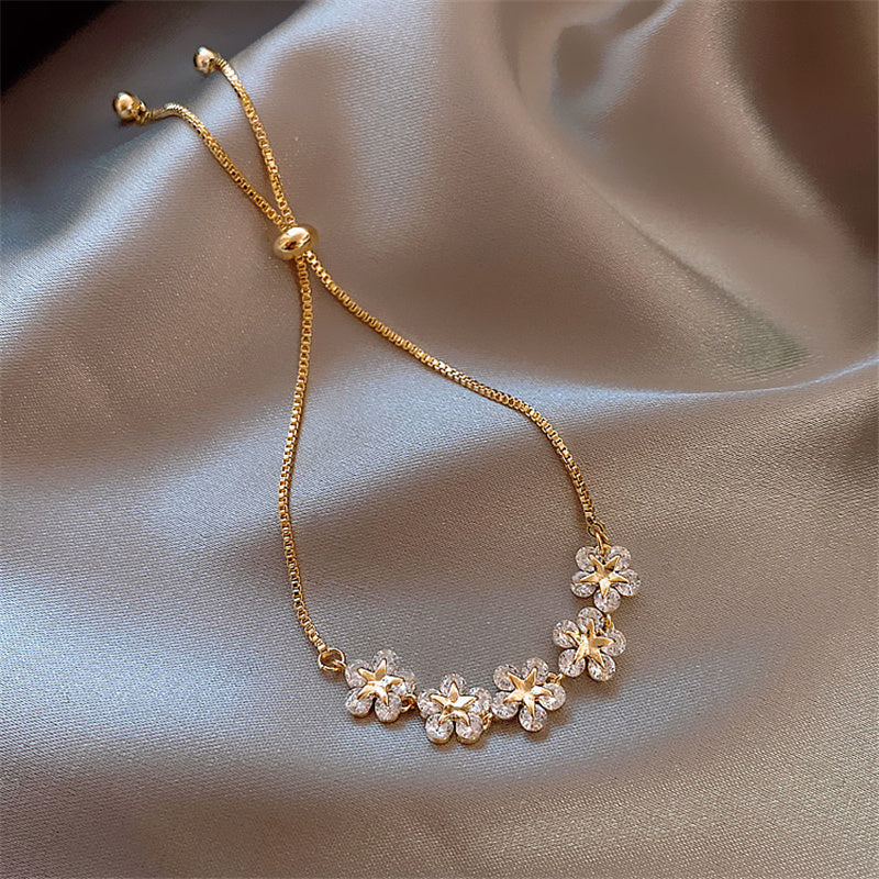 Golden Bracelet with Crystal Daisy Design