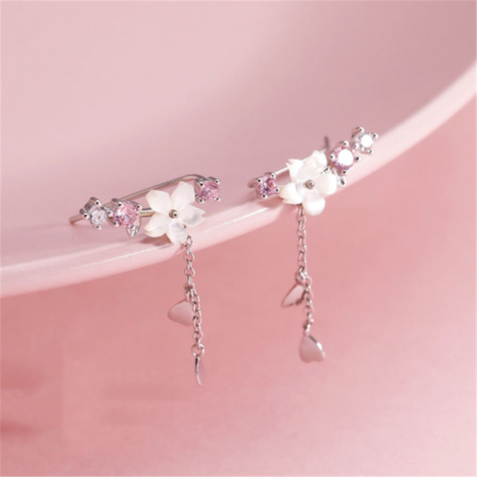 Elegant silver earrings with delicate pink stones in a floral design