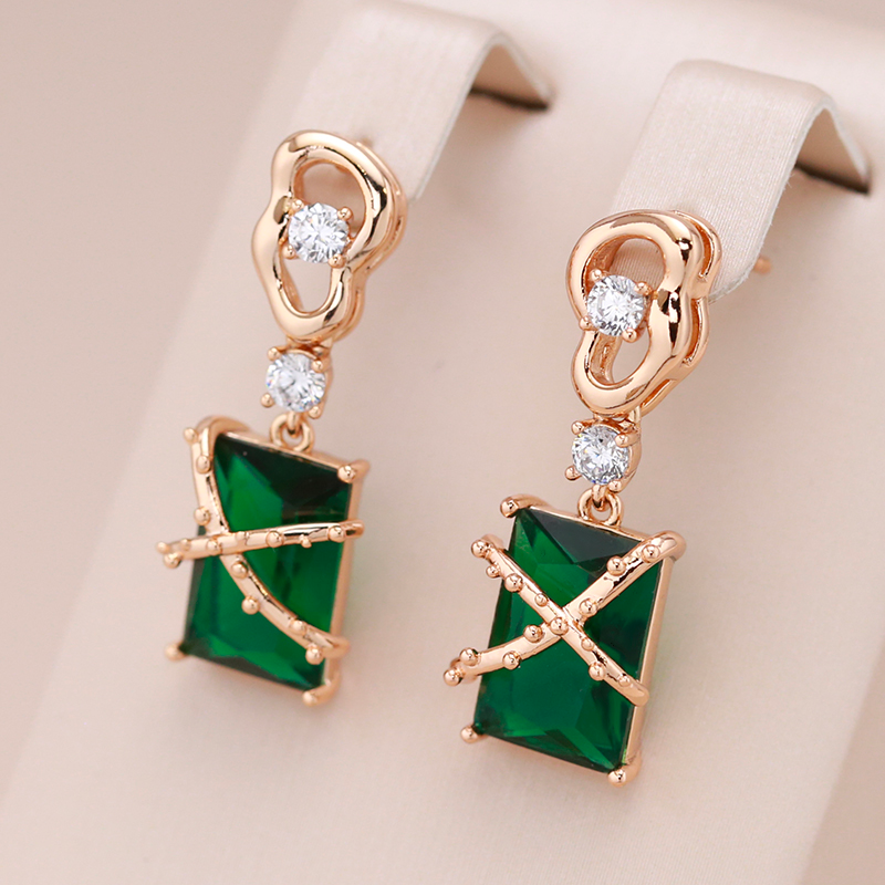 Elegant small earrings with sparkling green crystal in noble gold