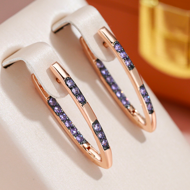 Radiant gold earrings with sparkling purple zirconia stones