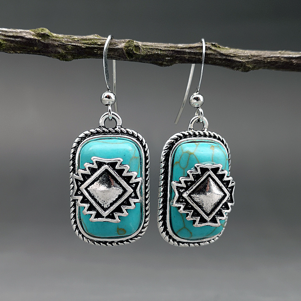 Elegant Ethno Earrings with Silver-Plated Finish and Radiant Turquoise Stone