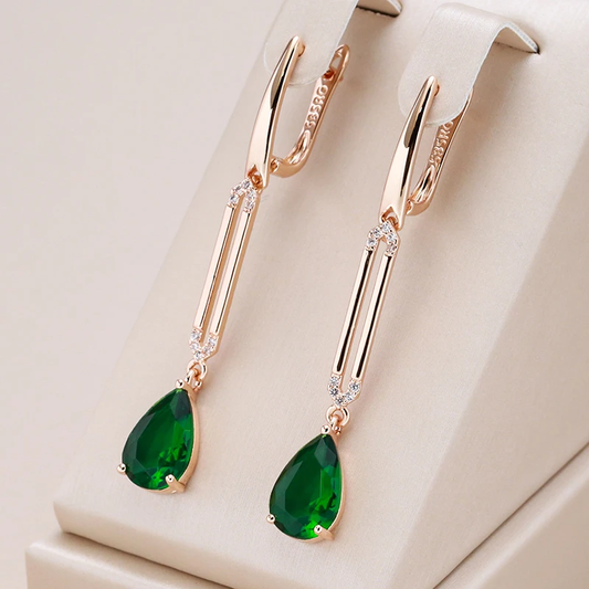 Elegant gold earrings with dazzling green crystal pendants