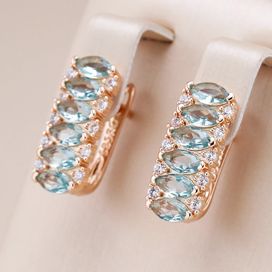 Elegant gold earrings with turquoise crystals