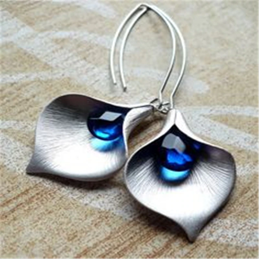 Elegant silver earrings with blue lotus flower design