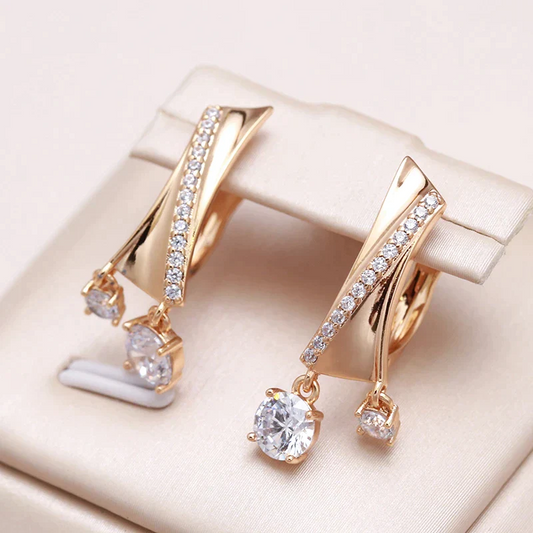 Glamorous gold earrings with radiant white crystal