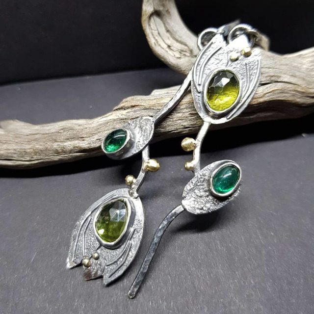 Stylish Boho earrings made of sterling silver with sparkling green stones