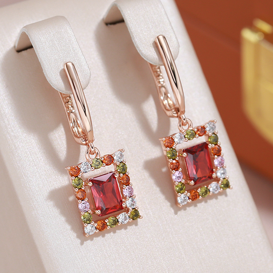 Stylish gold earrings with sparkling red cubic crystal