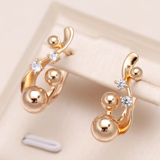 Glamorous gold earrings with sparkling cubic zirconia stones