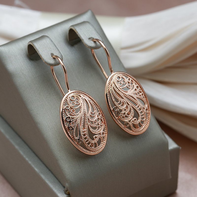 Glamorous gold earrings with radiant shine