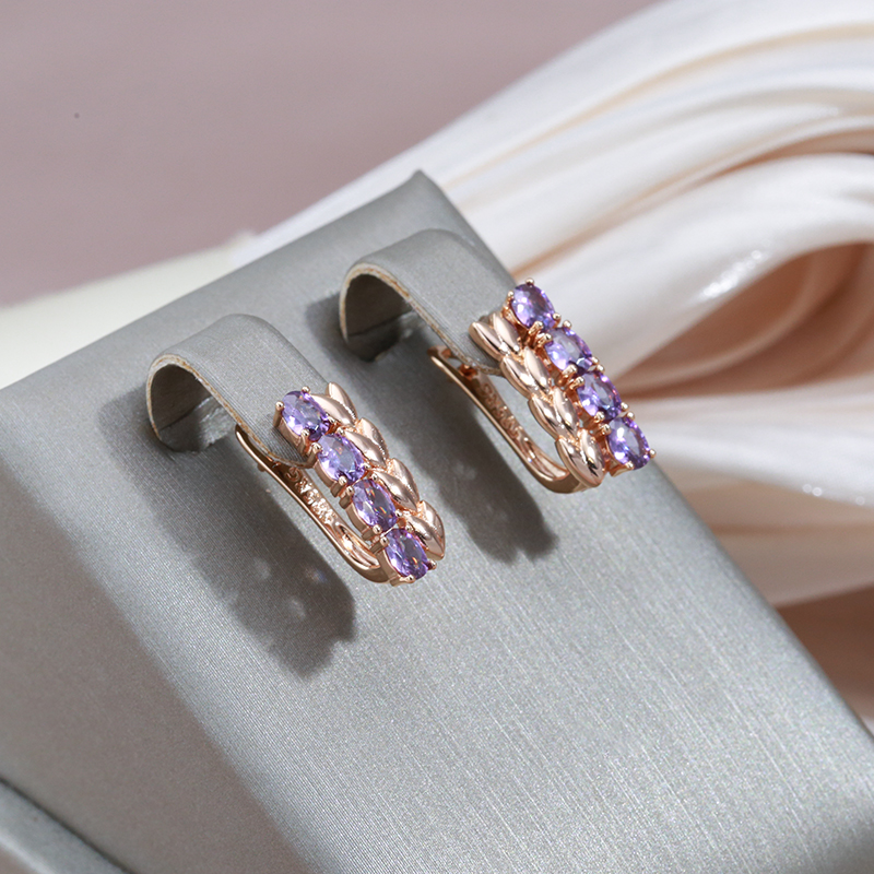 Radiant golden earrings with sparkling purple zirconias – the epitome of elegant jewelry dreams!