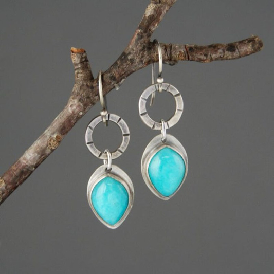 Elegant Vintage Earrings with Radiant Blue Stone in Noble Silver