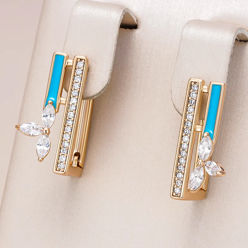 Fascinating gold earrings with radiant blue enamel and sparkling zirconia stones