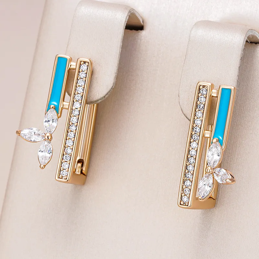 Fascinating gold earrings with radiant blue enamel and sparkling zirconia stones