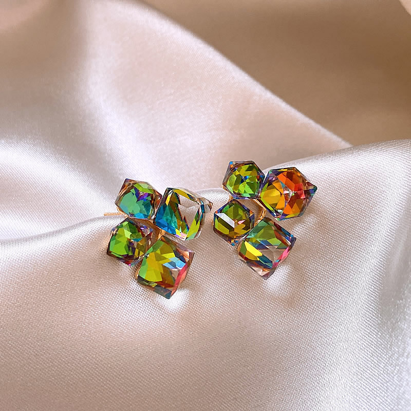 Elegant golden earrings with colorful zirconia stones