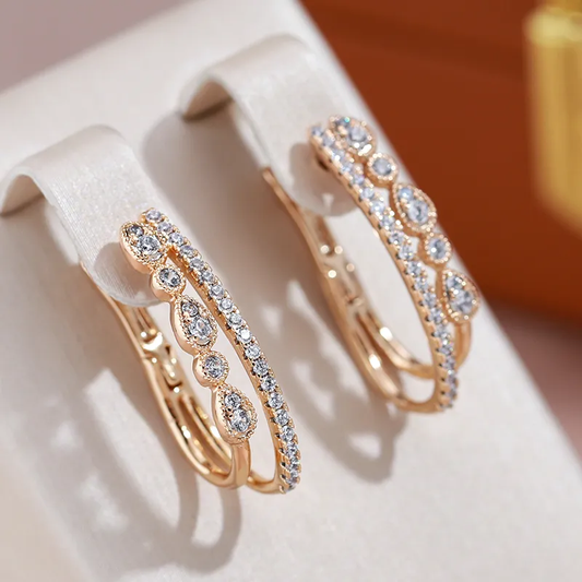 Luxurious gold earrings with sparkling zirconia stones