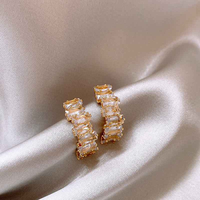 Luxurious gold earrings with shimmering zirconia stones