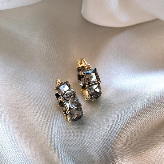 Elegant gold earrings with sparkling black zirconia