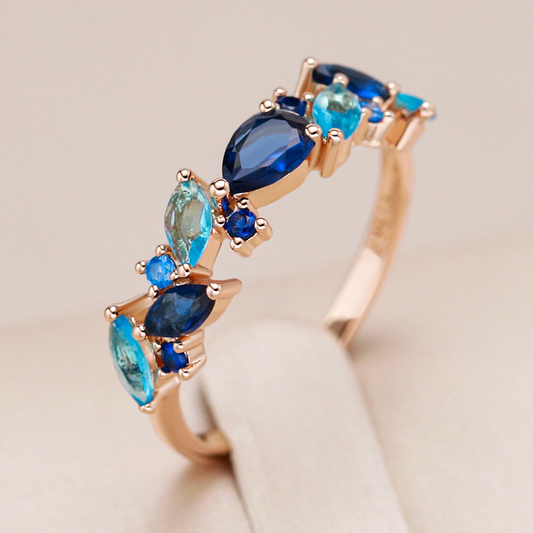 Elegant gold-plated ring with sparkling blue crystals