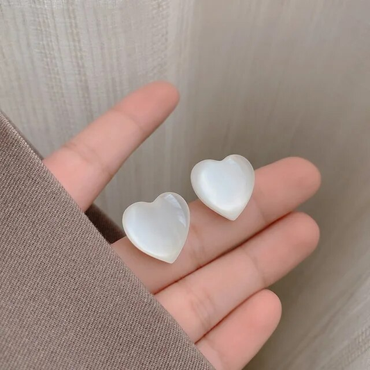 Chic earrings with enchanting white hearts