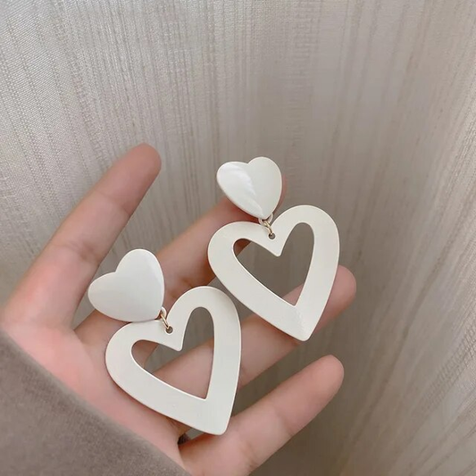 Chic and stylish hollow white heart earrings