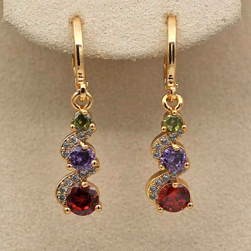 Stylish earrings with radiant golden zirconia