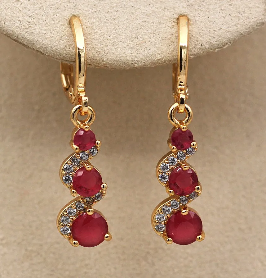 Stylish earrings with radiant golden zirconia