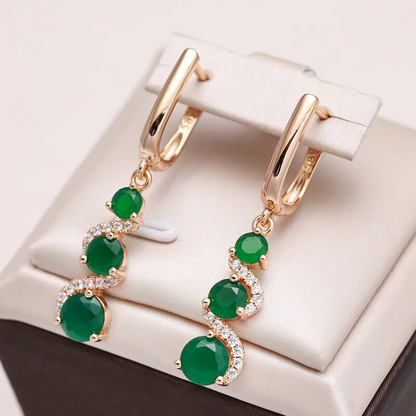 Stylish earrings with radiant golden zirconia