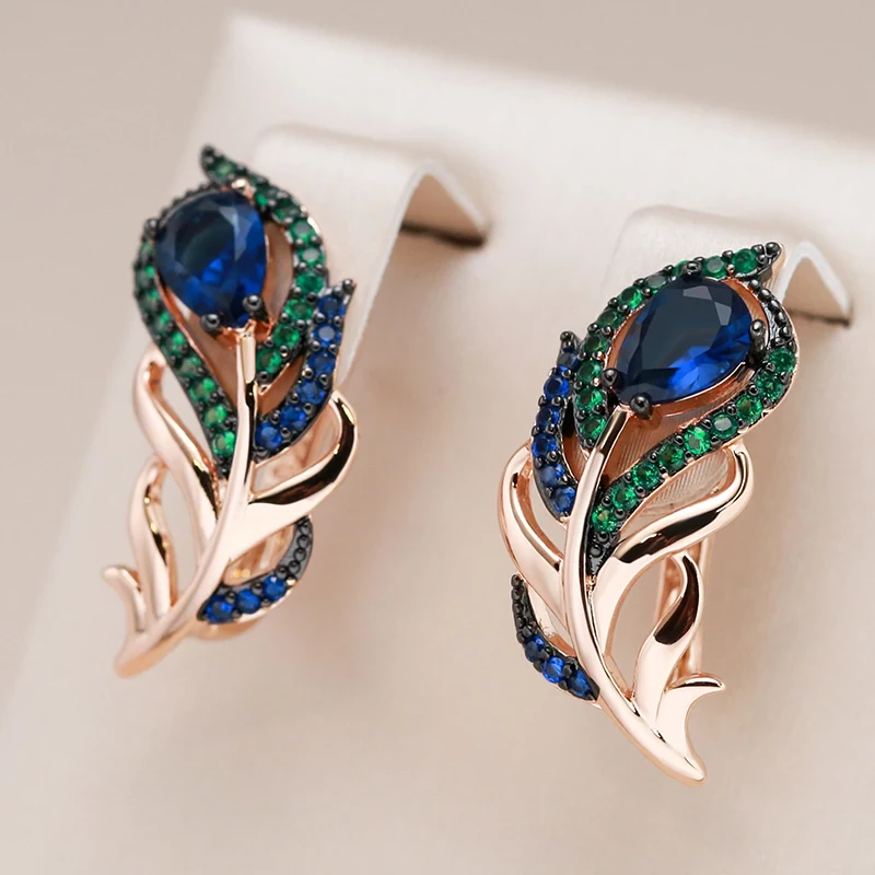 Stylish earrings with sparkling green and blue crystals