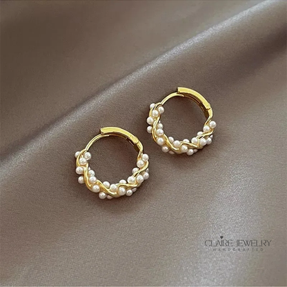 Elegant round pearl earrings with inlays