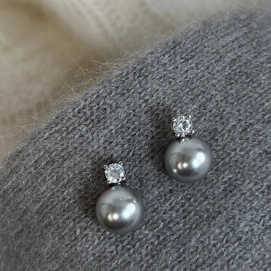 Stylish black pearl earrings with sparkling zirconia stones