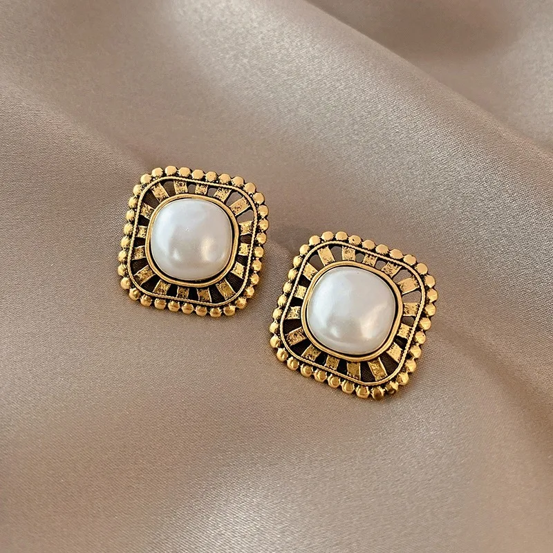 Elegant gold-plated earrings with sparkling pearl accents