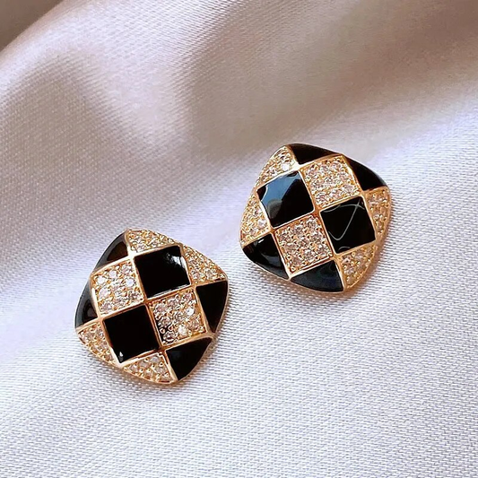 Stylish earrings made of shimmering black enamel