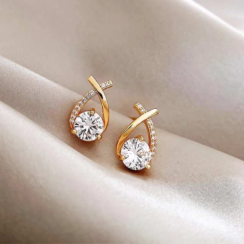 Gleaming, stylish earrings with sparkling cross-shaped zirconia stones