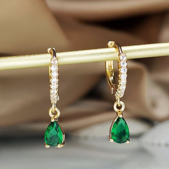 Elegant gold earrings with sparkling crystal pendant