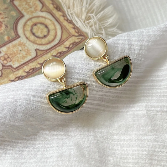 Stylish earrings made of radiant green polished stone