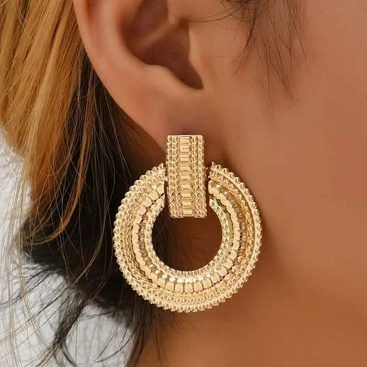 Stylish golden mandala earrings with intricate design