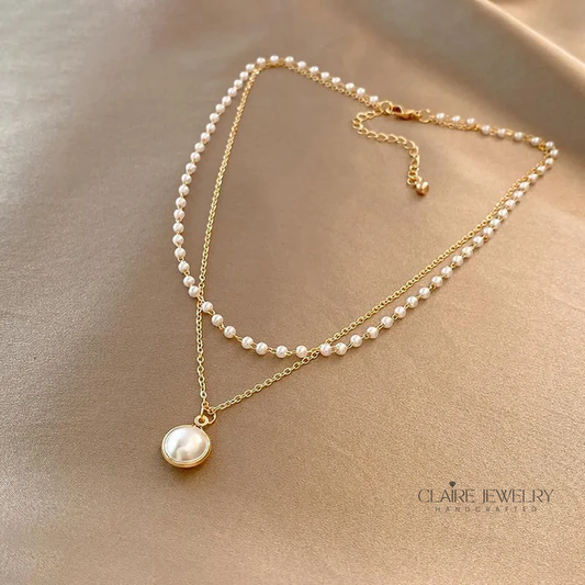 Elegant pearls in gold necklace