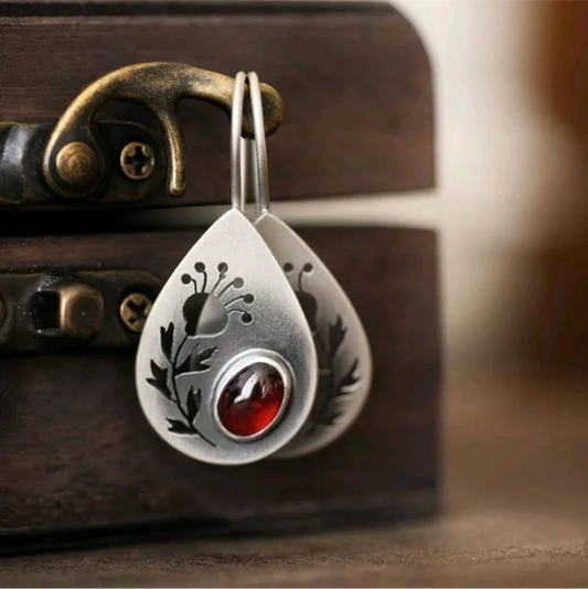 Vintage-inspired earrings with bright red crystal drops