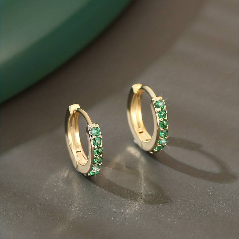 Stylish earrings with sparkling green zirconia design