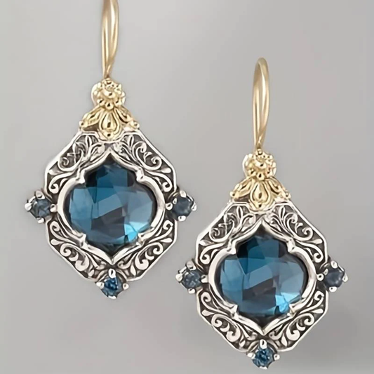 Elegant earrings with blue crystals in exquisite gold and silver