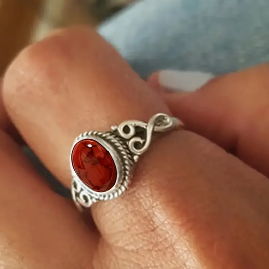 Fascinating vintage ring with a glowing red gemstone