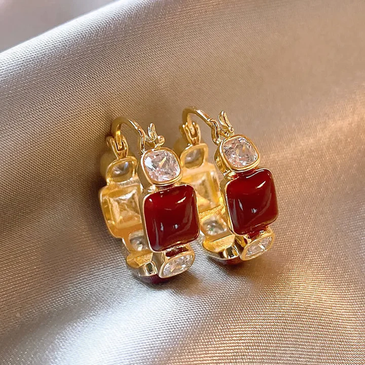 Fascinating red zirconia earrings for a glamorous appearance