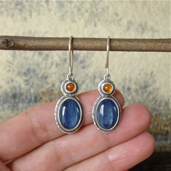 Vintage earrings in vibrant blue and orange for a stylish accent