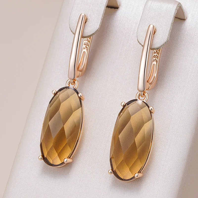 Stylish oval earrings with luxurious brown crystal.