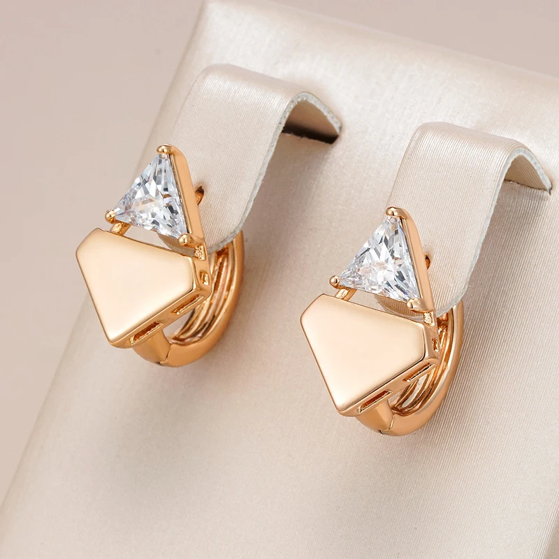 Elegant gold earrings with shiny peak appliqué