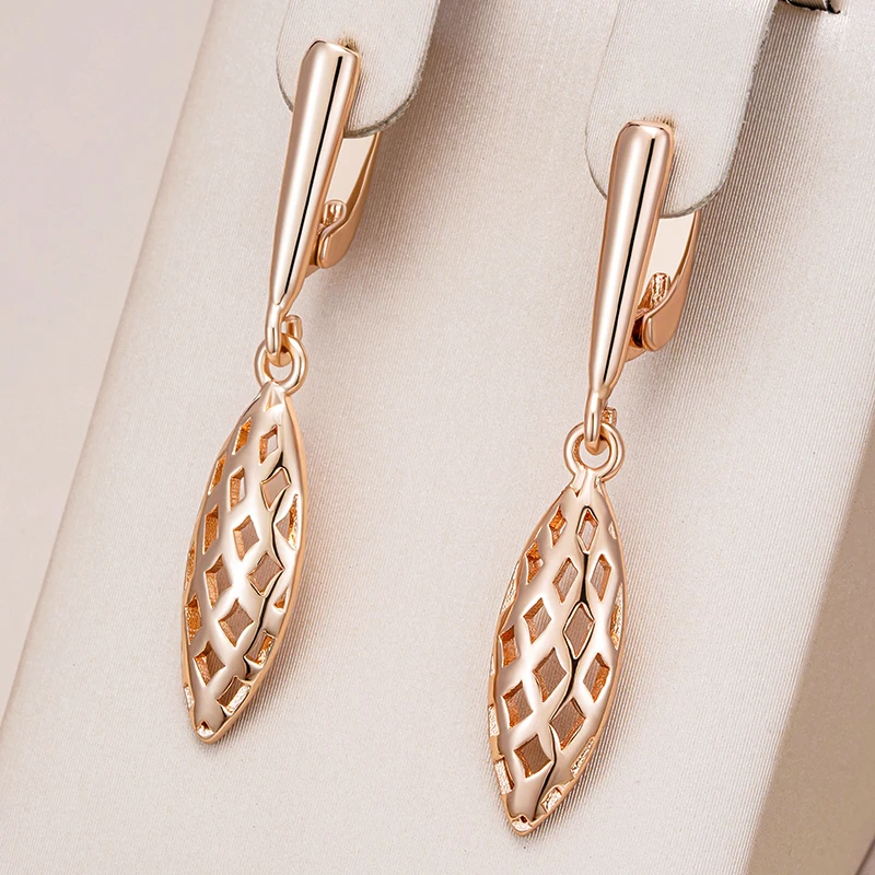 Elegant, gold-plated drop earrings with hollow design