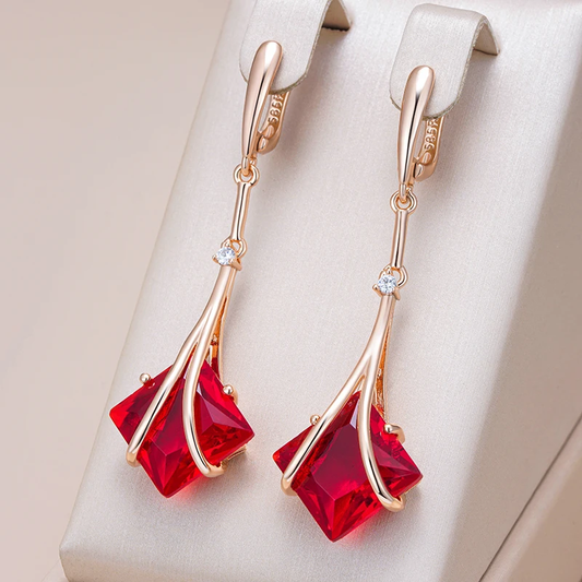 Elegant drop earrings with a radiant red crystal